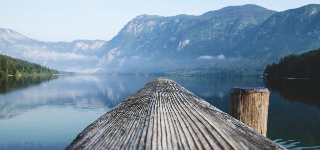 Pier Over Lake Against Mountains